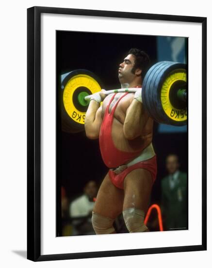 Male Lifting Heavy Weights in Competition at the Olympics-John Dominis-Framed Premium Photographic Print