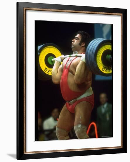 Male Lifting Heavy Weights in Competition at the Olympics-John Dominis-Framed Premium Photographic Print