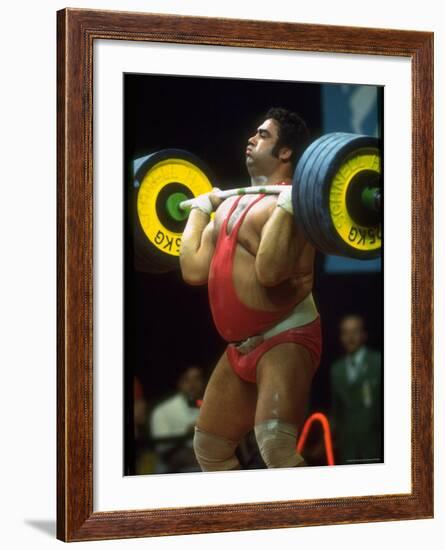 Male Lifting Heavy Weights in Competition at the Olympics-John Dominis-Framed Premium Photographic Print