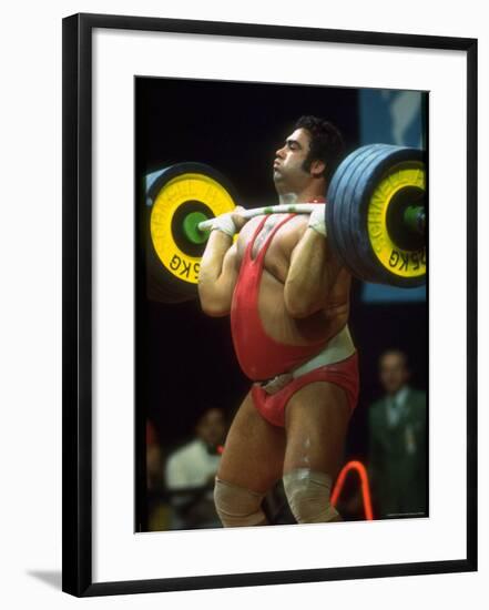 Male Lifting Heavy Weights in Competition at the Olympics-John Dominis-Framed Premium Photographic Print