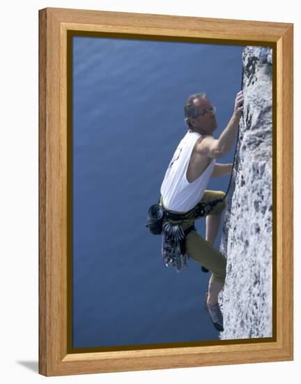 Male Rock Climber Reaching for a Grip-null-Framed Premier Image Canvas