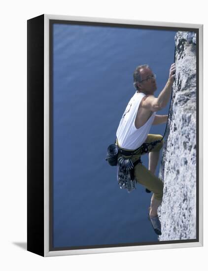 Male Rock Climber Reaching for a Grip-null-Framed Premier Image Canvas