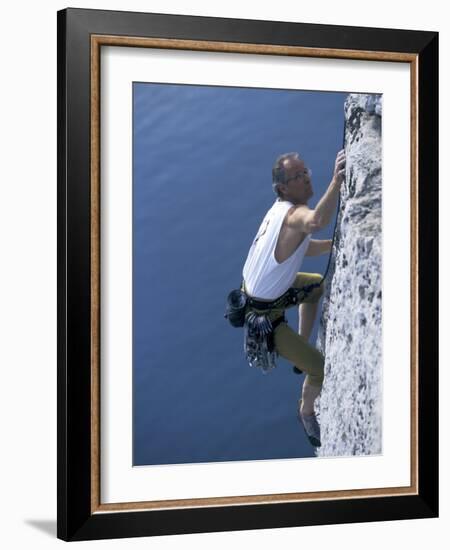 Male Rock Climber Reaching for a Grip-null-Framed Photographic Print