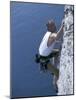 Male Rock Climber Reaching for a Grip-null-Mounted Photographic Print