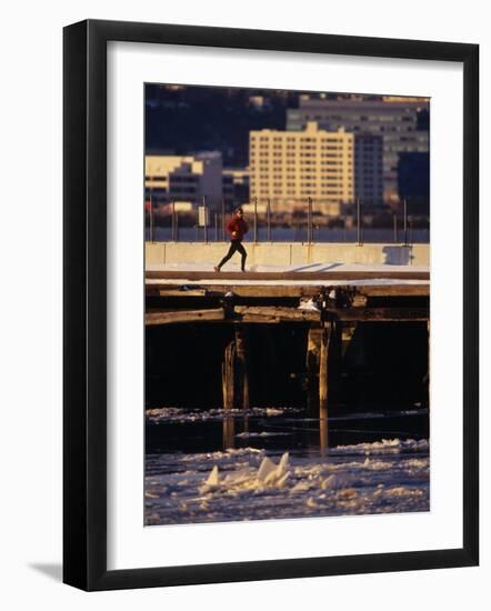 Male Running in Snow Through the City, New York, New York, USA-null-Framed Photographic Print