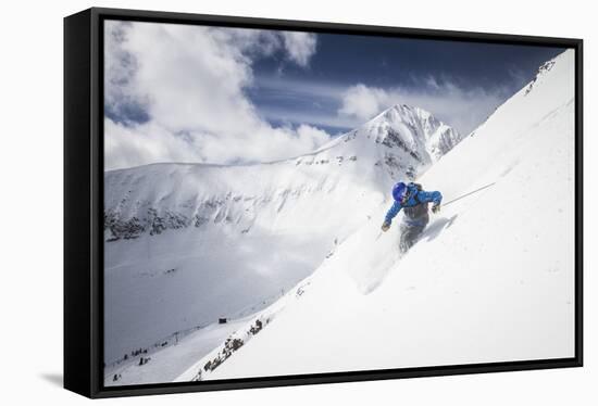 Male Skier Above The Pinnacles With Lone Peak In The Background Big Sky Resort, Montana-Ryan Krueger-Framed Stretched Canvas