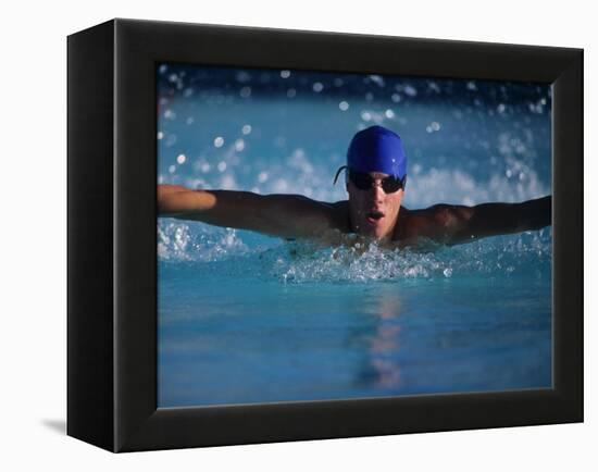 Male Swimmer Competing in Abutterfly Race-null-Framed Premier Image Canvas