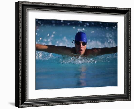 Male Swimmer Competing in Abutterfly Race-null-Framed Photographic Print