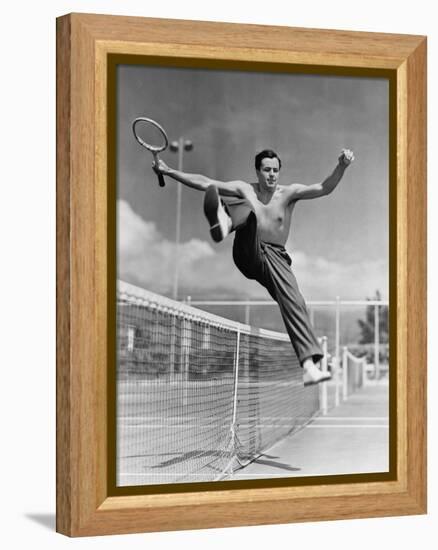 Male Tennis Player Jumping over Net-null-Framed Stretched Canvas