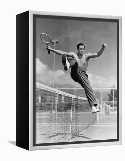 Male Tennis Player Jumping over Net-null-Framed Stretched Canvas