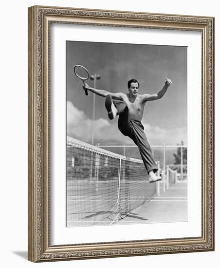 Male Tennis Player Jumping over Net-null-Framed Photo