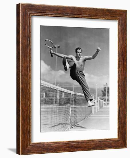 Male Tennis Player Jumping over Net-null-Framed Photo