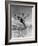 Male Tennis Player Jumping over Net-null-Framed Photo