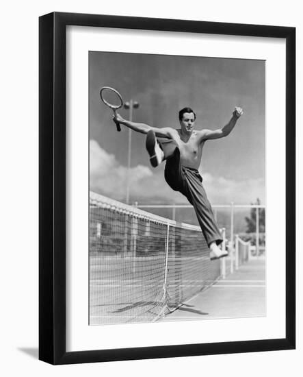 Male Tennis Player Jumping over Net-null-Framed Photo