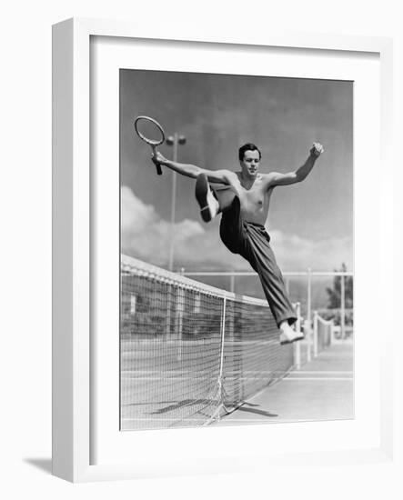 Male Tennis Player Jumping over Net-null-Framed Photo