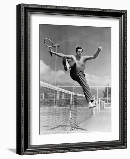 Male Tennis Player Jumping over Net-null-Framed Photo