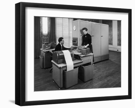 Man and a Women Working Together with a Pegasus Computer-null-Framed Photographic Print