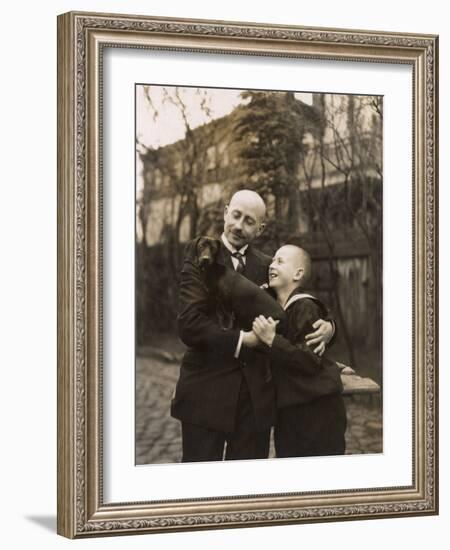 Man and Boy Holding a Dachshund-null-Framed Photographic Print