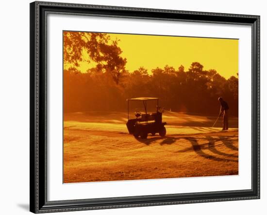 Man and Golf Cart Silhouetted at Sunset-Bill Bachmann-Framed Photographic Print