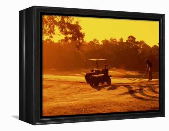 Man and Golf Cart Silhouetted at Sunset-Bill Bachmann-Framed Premier Image Canvas