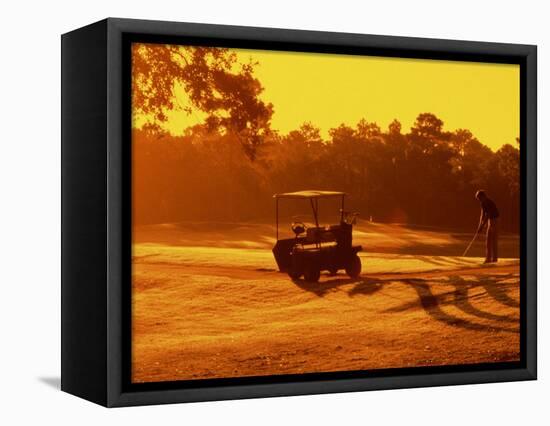 Man and Golf Cart Silhouetted at Sunset-Bill Bachmann-Framed Premier Image Canvas