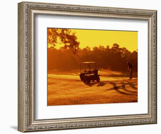 Man and Golf Cart Silhouetted at Sunset-Bill Bachmann-Framed Photographic Print