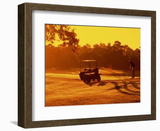 Man and Golf Cart Silhouetted at Sunset-Bill Bachmann-Framed Photographic Print