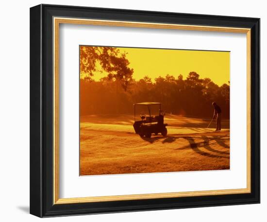 Man and Golf Cart Silhouetted at Sunset-Bill Bachmann-Framed Photographic Print