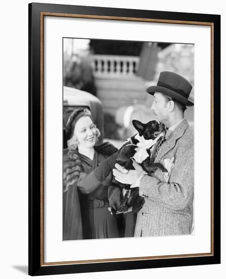 Man and Woman Holding a Little Dog-null-Framed Photo