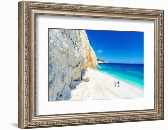 Man and woman holding hands on the idyllic Fteri Beach, overhead view, Kefalonia-Roberto Moiola-Framed Photographic Print