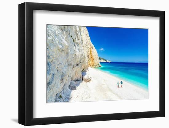 Man and woman holding hands on the idyllic Fteri Beach, overhead view, Kefalonia-Roberto Moiola-Framed Photographic Print