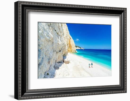 Man and woman holding hands on the idyllic Fteri Beach, overhead view, Kefalonia-Roberto Moiola-Framed Photographic Print