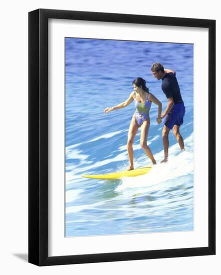 Man and Woman on a Surfboard-null-Framed Photographic Print