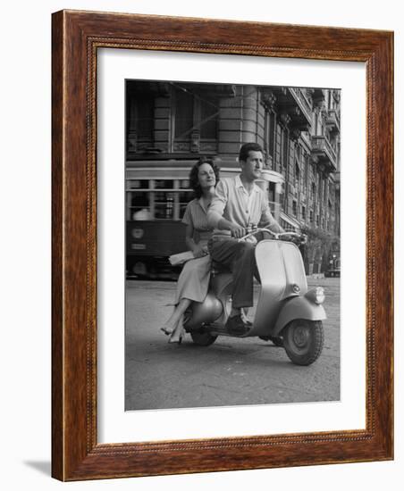 Man and Woman Riding a Vespa Scooter-Dmitri Kessel-Framed Photographic Print