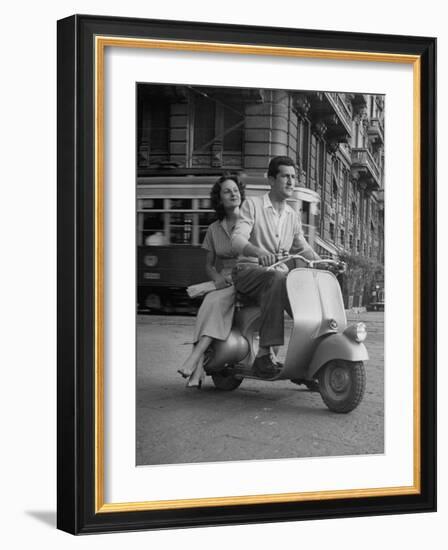 Man and Woman Riding a Vespa Scooter-Dmitri Kessel-Framed Photographic Print