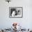 Man Bending over a Piece of Paper on His Dresser and Holding His Head-null-Framed Photo displayed on a wall