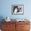 Man Bending over a Piece of Paper on His Dresser and Holding His Head-null-Framed Photo displayed on a wall