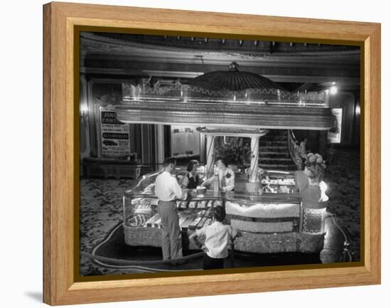 Man Buying Snacks at the Movie Concession Stand-Peter Stackpole-Framed Premier Image Canvas