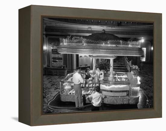 Man Buying Snacks at the Movie Concession Stand-Peter Stackpole-Framed Premier Image Canvas