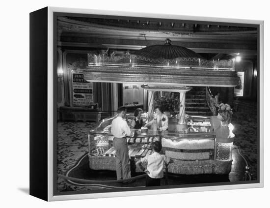 Man Buying Snacks at the Movie Concession Stand-Peter Stackpole-Framed Premier Image Canvas