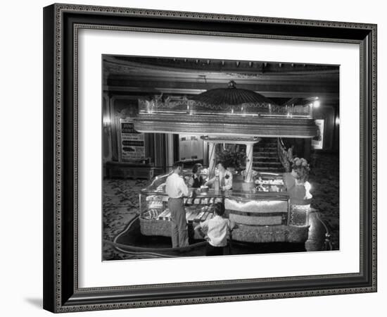 Man Buying Snacks at the Movie Concession Stand-Peter Stackpole-Framed Photographic Print