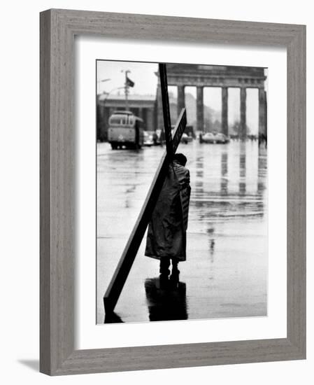 Man Carrying Cross, Berlin, October 1961-Toni Frissell-Framed Photo