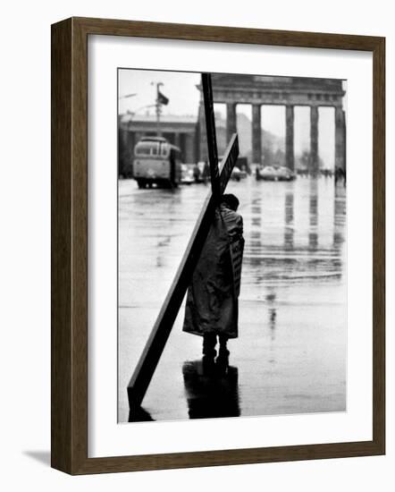 Man Carrying Cross, Berlin, October 1961-Toni Frissell-Framed Photo