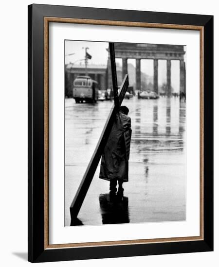 Man Carrying Cross, Berlin, October 1961-Toni Frissell-Framed Photo