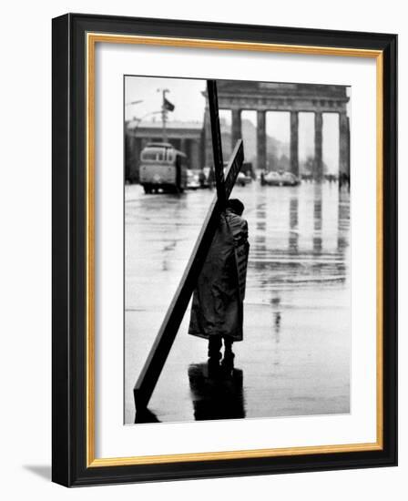 Man Carrying Cross, Berlin, October 1961-Toni Frissell-Framed Photo