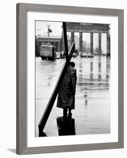 Man Carrying Cross, Berlin, October 1961-Toni Frissell-Framed Photo