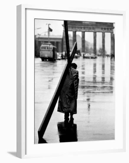 Man Carrying Cross, Berlin, October 1961-Toni Frissell-Framed Photo