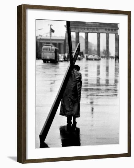 Man Carrying Cross, Berlin, October 1961-Toni Frissell-Framed Photo