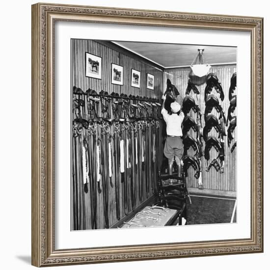 Man Checking Equipment Inside a Stable's Tack Room-Alfred Eisenstaedt-Framed Photographic Print