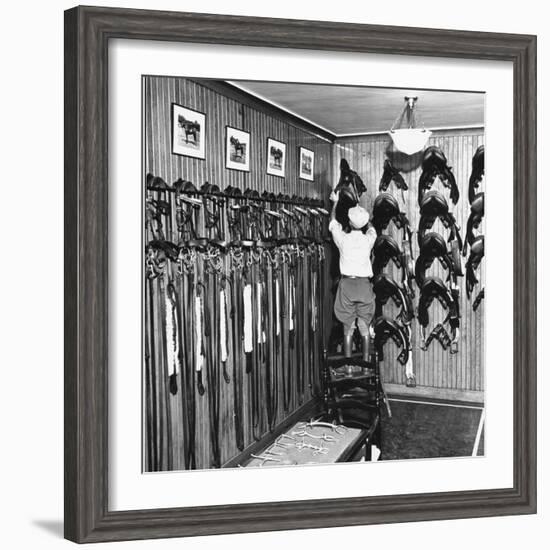 Man Checking Equipment Inside a Stable's Tack Room-Alfred Eisenstaedt-Framed Photographic Print